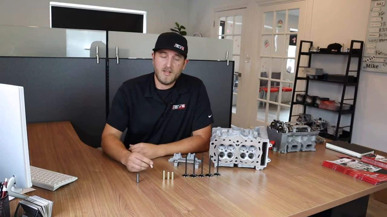 Rev6 Cylinder Heads spread out on a desk 
