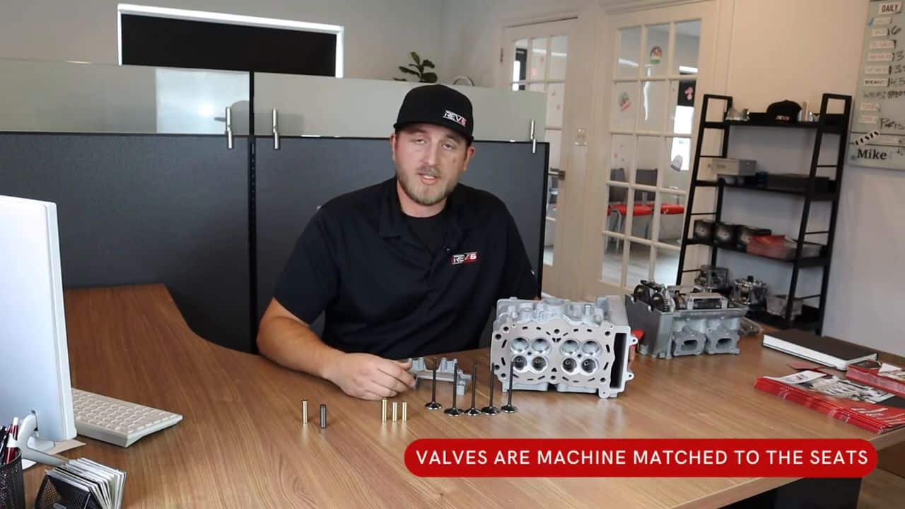 Mike from Rev6 showing valves are matched to the seats. Cylinder Heads displayed