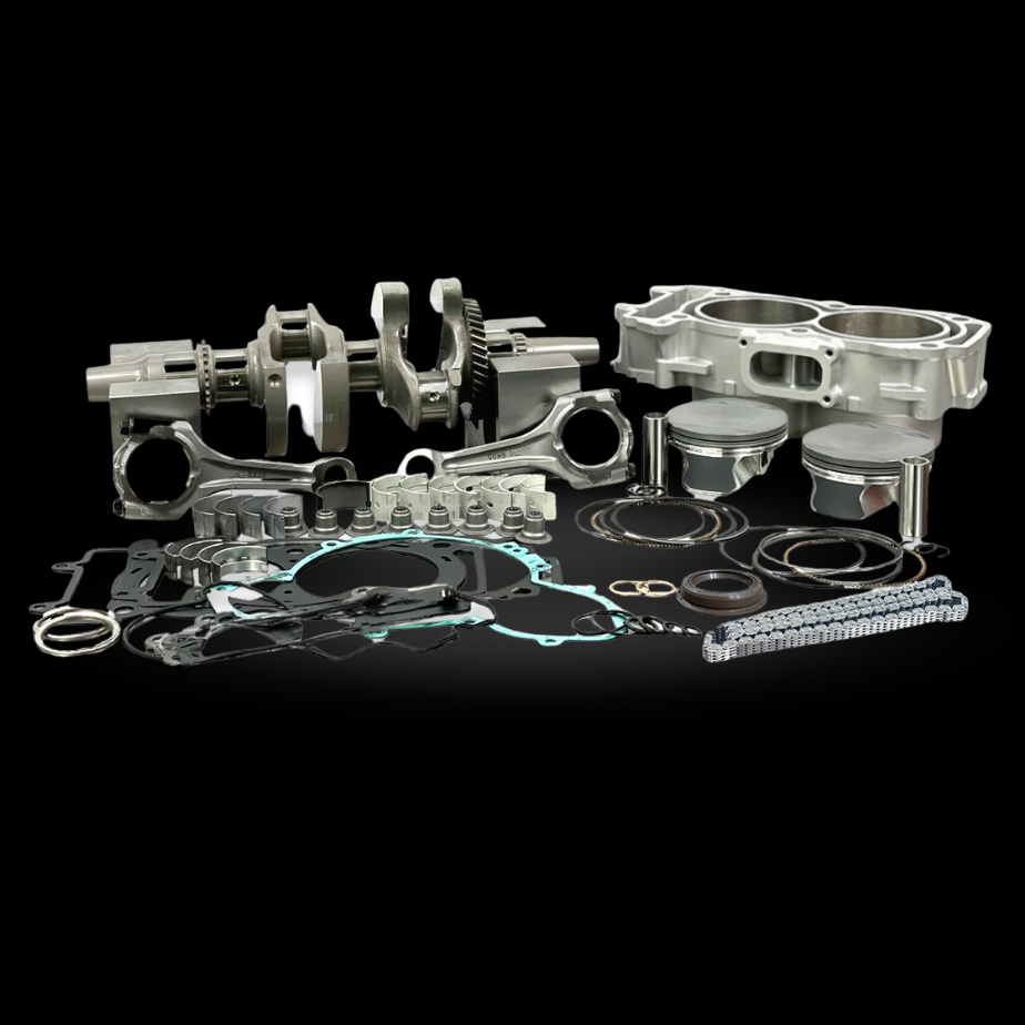 Complete engine rebuild kit components displayed on a black background, including crankshaft, connecting rods, pistons, cylinder block, gaskets, seals, piston rings, and timing chain.