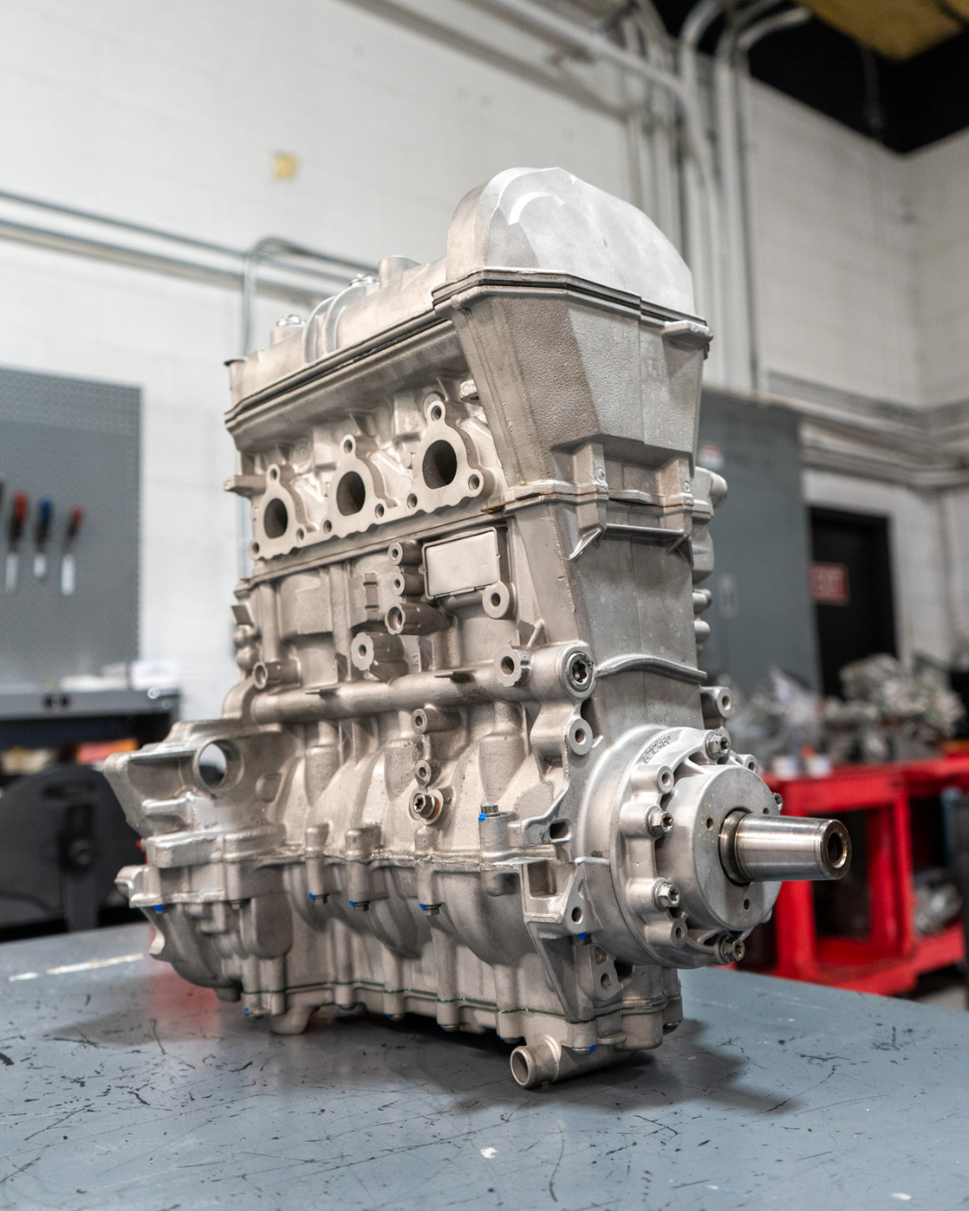 Fully assembled Yamaha UTV engine on workbench after complete REV6 remanufacturing process.