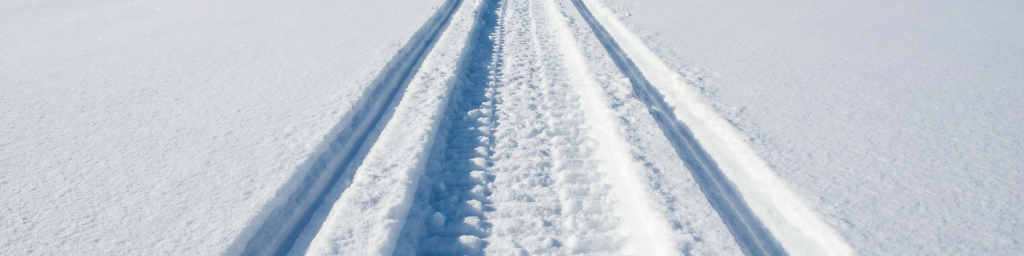 Polaris RMK Snowmobile tracks made by riders from REV6 